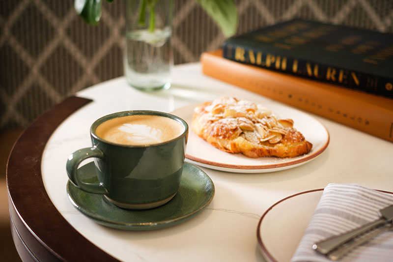 pastry and latte on table